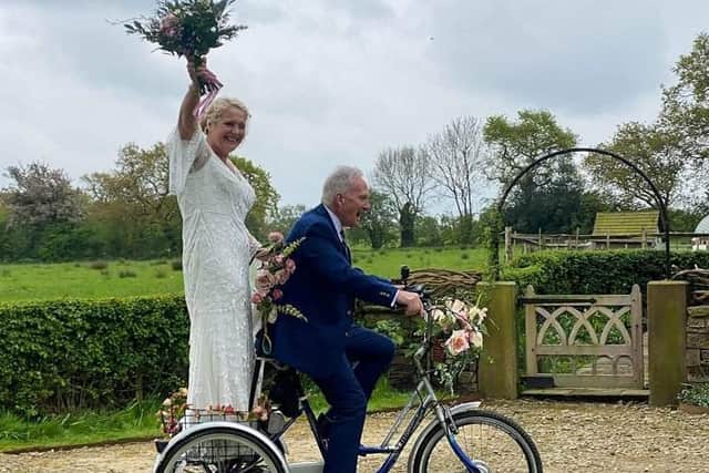 Bride Ruth Gaspar arrives at her wedding on a tricycle with her 87-year-old dad Tony Newton