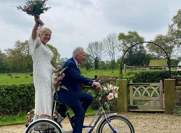 Bride Ruth Gaspar arrives at her wedding on a tricycle with her 87-year-old dad Tony Newton