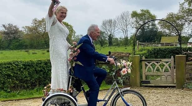 Bride Ruth Gaspar arrives at her wedding on a tricycle with her 87-year-old dad Tony Newton