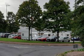 Caravans encamped on the car park outside Robin Park Sports Centre