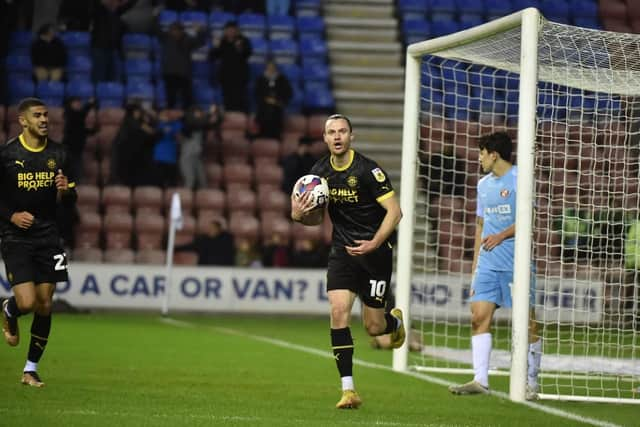 Will Keane celebrates after equalising for Latics