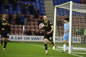 Will Keane celebrates after equalising for Latics