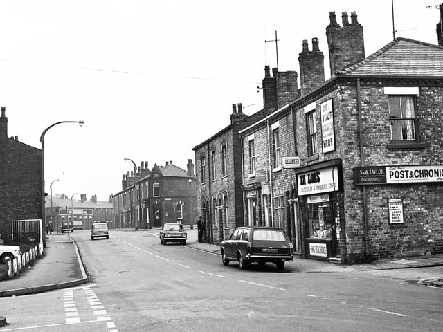 Frog Lane in 1971 with Taylor's newsagents on the corner of Glebe End Street with Gidlow Lane branching off further up to the right. The junction of Prescott Street is on the left.