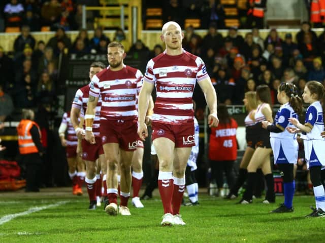 Liam Farrell leads out the Warriors.
