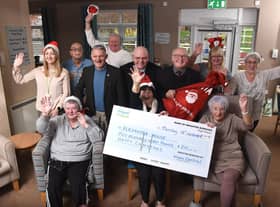 Three ward councillors of Wigan Central bring a little Christmas cheer to the staff and residents of  Alexandra Nursing Home at Whelley with a £250 cheque for a Christmas party.