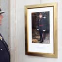 The High Sheriff of Greater Manchester, Martin Ainscough admires his portrait.