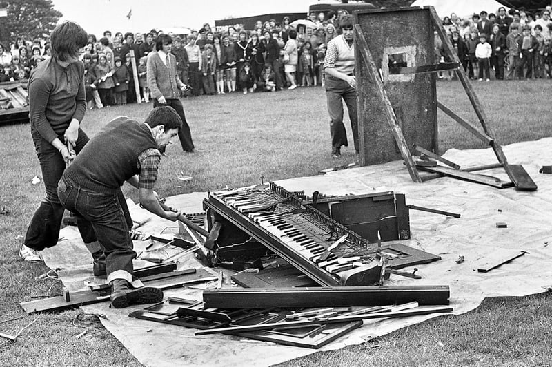 Piano smashing was a popular event at galas in the 1970s where an upright was demolished in the fastest possible time and the pieces had to be passed through a 9 inch hole. Here some hammer wielding lads are hard at work at St. Wilfrid's Gala, Standish, on Saturday 17th of June 1972.
