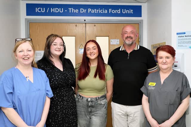 Julie Bramhall's family with members of ICU staff
