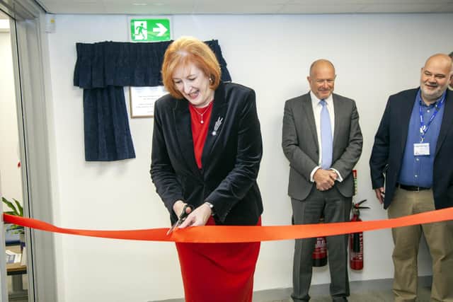Yvonne Fovargue cutting the ribbon at the clinical research hub in Ashton