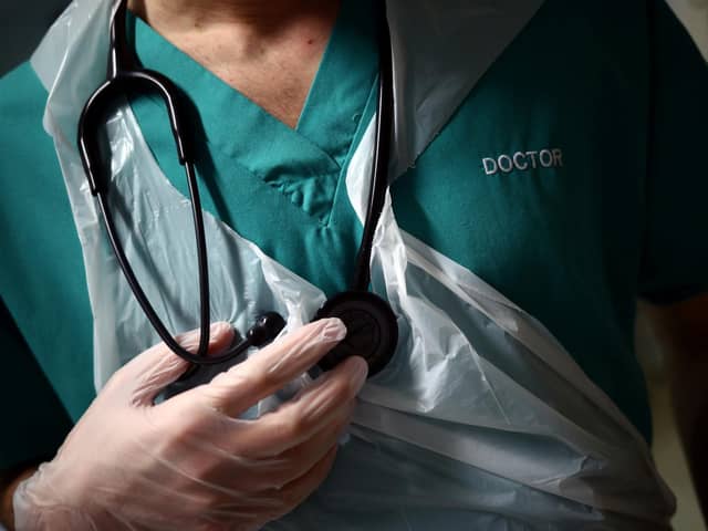 BLACKBURN, ENGLAND - MAY 14: A Junior Doctor holds his stethoscope during a patient visit on Ward C22 at The Royal Blackburn Teaching Hospital in East Lancashire, during the current coronavirus disease (COVID-19) epidemic, on May 14, 2020 in Blackburn, England.  (Photo by Hannah McKay - Pool/Getty Images)