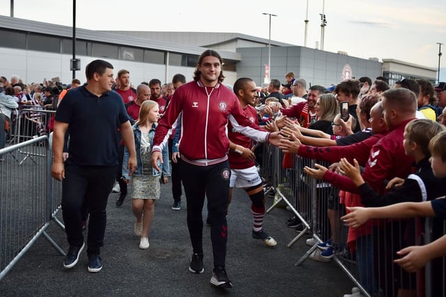 Liam Byrne says hello to the fans on his way across to the DW Stadium.