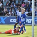 Joe Hugill scores his and Latics' second goal at Bristol Rovers with a typical poacher's finish