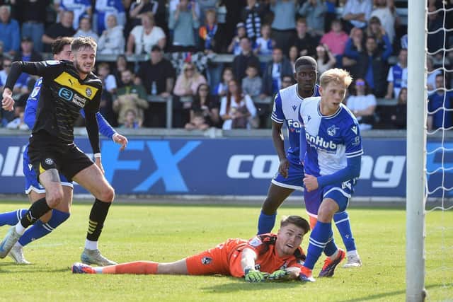 Joe Hugill scores his and Latics' second goal at Bristol Rovers with a typical poacher's finish