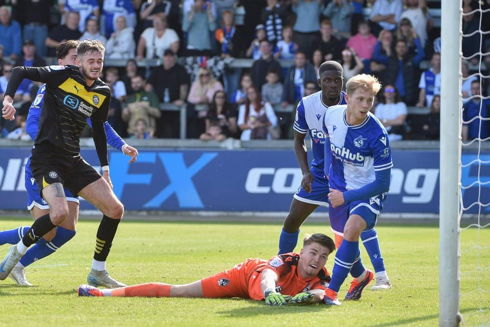 Joe Hugill scores his and Latics' second goal at Bristol Rovers with a typical poacher's finish
