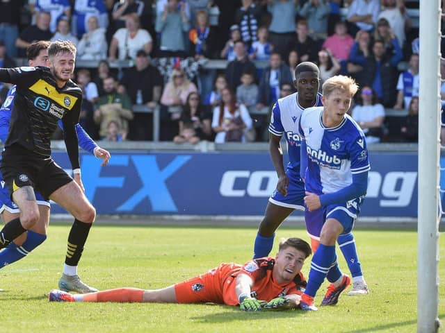 Joe Hugill scores his and Latics' second goal at Bristol Rovers with a typical poacher's finish