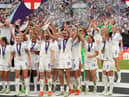 England's Ellen White and Jill Scott lift the trophy as England celebrate winning the UEFA Women's Euro 2022 final at Wembley Stadium, London. Picture date: Sunday July 31, 2022.