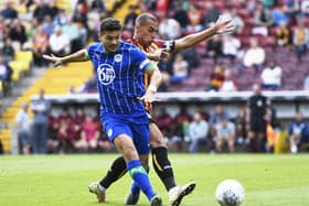 James Vaughan - seen in action for Bradford against Latics - has been promoted at Everton