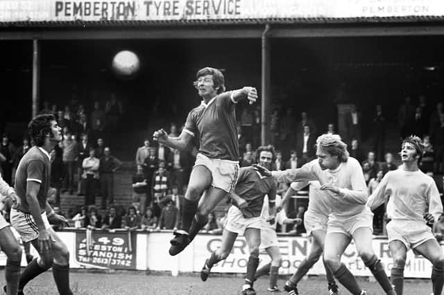 Wigan Athletic forward Jimmy Garrett climbs highest against Gainsborough Trinity in a Northern Premier League match at Springfield Park on Saturday 30th of August 1975 which ended in a 0-0 draw.