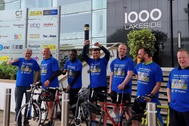 The team of cyclists at Langdon Systems after completing their charitable bike ride.
