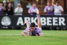 Wigan Warriors young gun Jack Farrimond goes over for a try against Huddersfield Giants