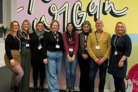 Recovery workers stand alongside social work team members