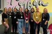 Recovery workers stand alongside social work team members