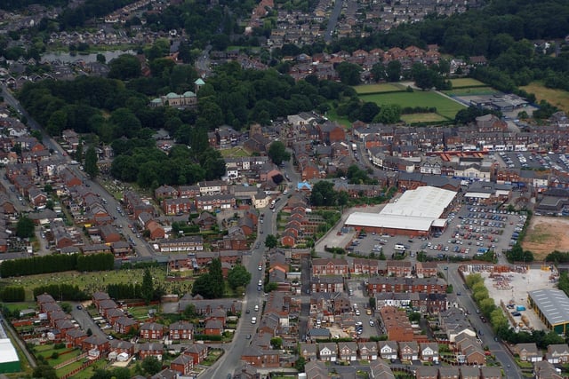 WIGAN AERIAL PICTURES - Ashton-in-Makerfield town centre, Heath Road leads up to St Thomas CE Church, near the tree-surrounded St Oswald's Catholic Church, which seems far removed from the hustle and bustle of the shops on and around Gerard Street.