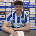 Luke Chambers puts pen to paper at the DW