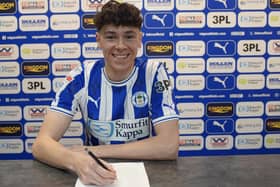 Luke Chambers puts pen to paper at the DW