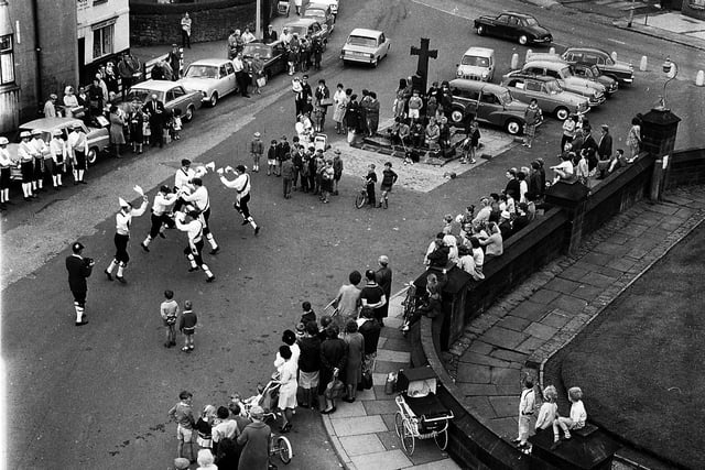 A great flashback photograph of village life in Standish during the summer of 1968. Taken from the tower of St Wildrid's Church this picture shows  Morris Men entertaining  a  group of locals.