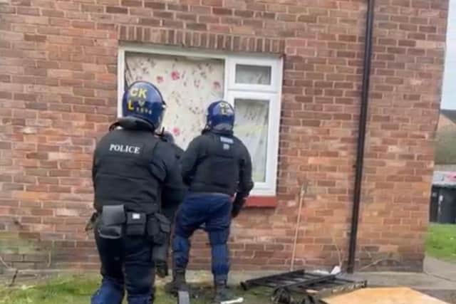 Officers carrying out a drugs raid in Worsley Hall, where two people were arrested
