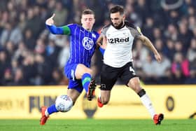 Lewis Macleod in action for Latics against Derby County's Graeme Shinnie