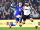 Lewis Macleod in action for Latics against Derby County's Graeme Shinnie