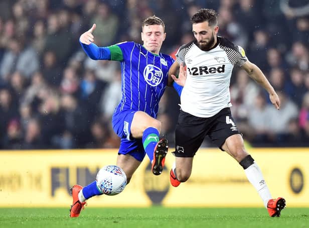 Lewis Macleod in action for Latics against Derby County's Graeme Shinnie