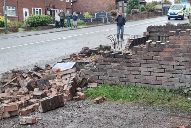 A garden wall demolished by the car
