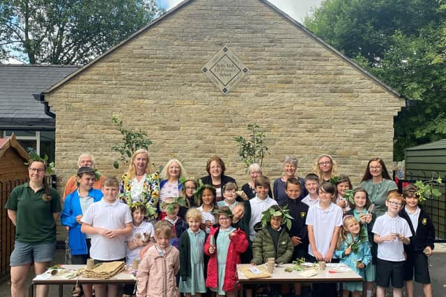 MP Rosie Cooper, back centre with pupils and staff from Roby Mill CE Primary School and staff from Beacon Park