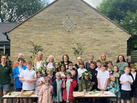 MP Rosie Cooper, back centre with pupils and staff from Roby Mill CE Primary School and staff from Beacon Park