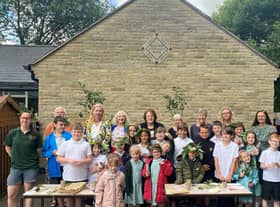 MP Rosie Cooper, back centre with pupils and staff from Roby Mill CE Primary School and staff from Beacon Park