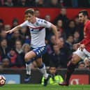 Callum Connolly in action for Latics against Manchester United in January 2017