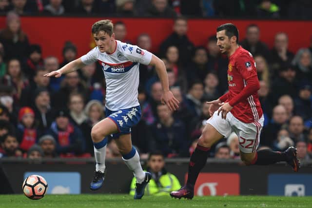 Callum Connolly in action for Latics against Manchester United in January 2017