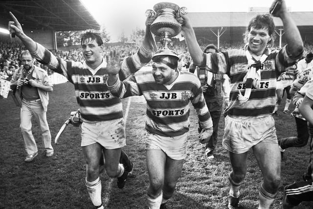 Andy Goodway, Nicky Kiss and Nick duToit parade the trophy around the pitch after beating Warrington 34-8 in the Lancashire Cup Final at Knowsley Road on Sunday 13th of October 1985.
