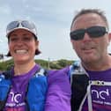 Three of the walkers with the Isle of Jersey's giant woven puffins artwork in the background, including (far right) Damian Glynn, brother of MND sufferer Chris Glynn