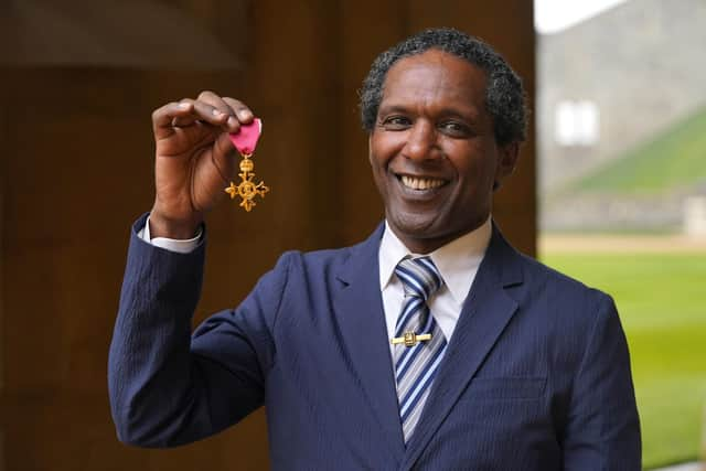 Lemn Sissay after being made an OBE by the Prince of Wales