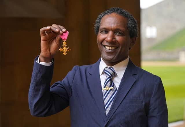 Lemn Sissay after being made an OBE by the Prince of Wales