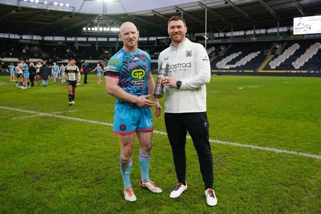 Warriors captain Liam Farrell with Scott Taylor following his testimonial fixture between Wigan and Hull