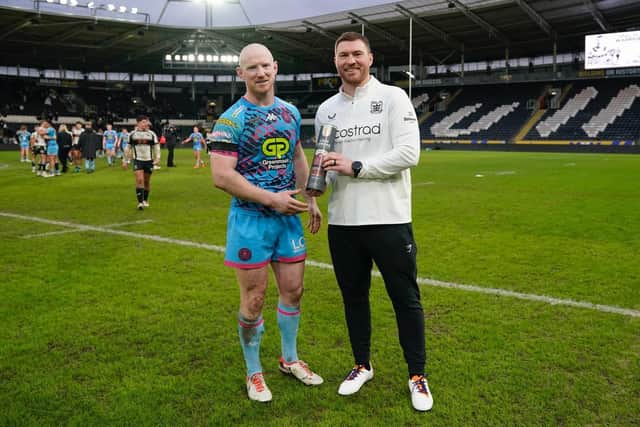 Warriors captain Liam Farrell with Scott Taylor following his testimonial fixture between Wigan and Hull
