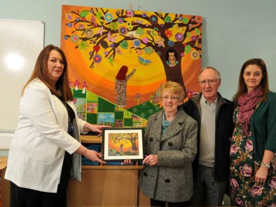 Alison's parents Leslie and Eunice Grace with Orrell Lamberhead Green headteacher Jane Chambers and artist Victoria Hough with the artwork commissioned her memory