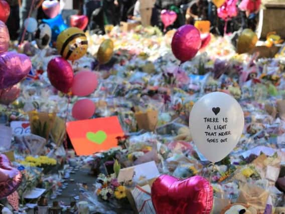 Tributes left at St Ann's Square in Manchester since the attack. Pic: Peter Byrne/PA Wire