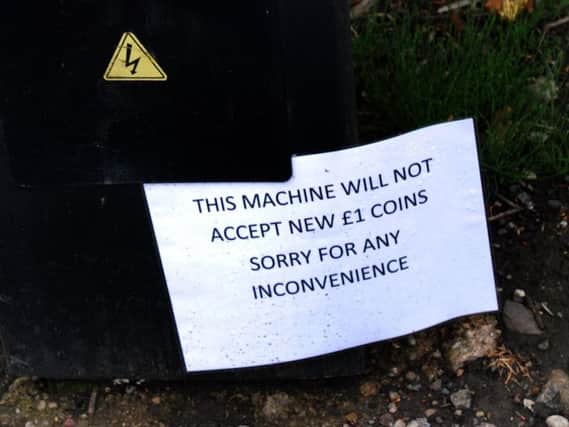 Wigan Council is in a war of words with a leading motoring organisation as it insisted work upgrading parking meters to take the new 1 coins is on the right road.