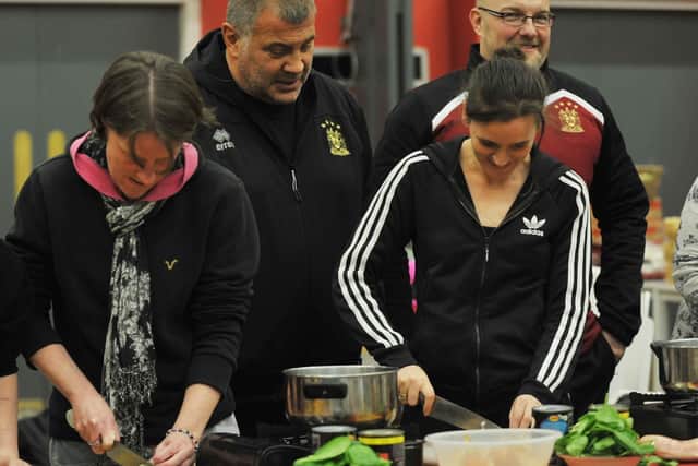 Wigan Warriors players and members of the Wigan Warriors Community Foundation hold a cooking demonstration in partnership with Fur Clemt and Westfield Start Well centre, held at Central Park, Wigan, part of the Wigan Warriors Community Blitz